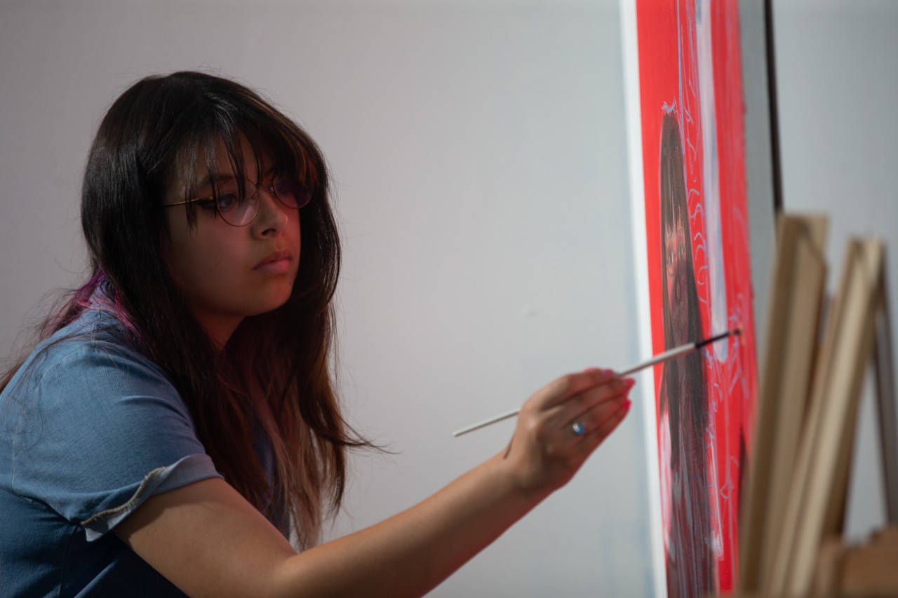 Filming an institutional spot/PSA. Fine Arts scene.