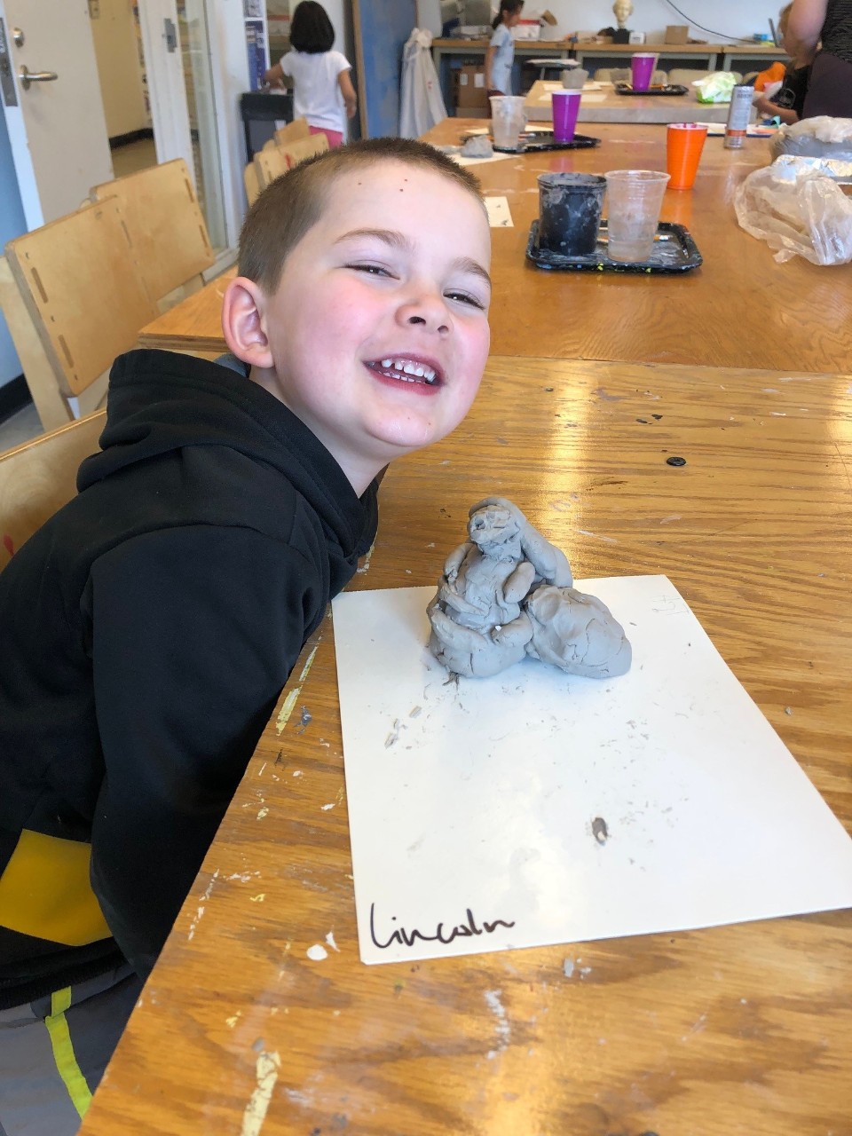Saturday Art Program student with clay art.