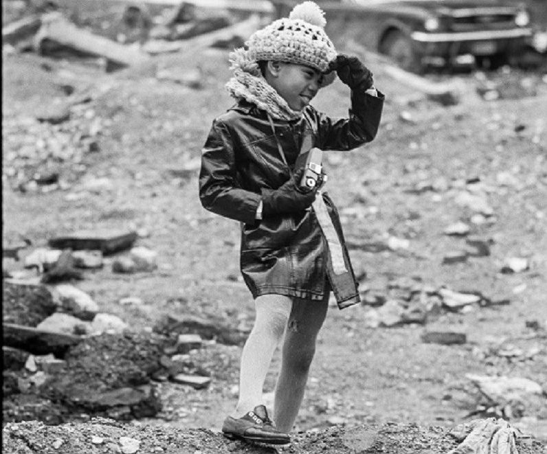 Child posing as tourist