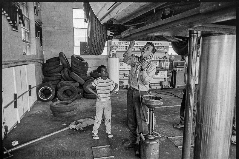 Child watching man work