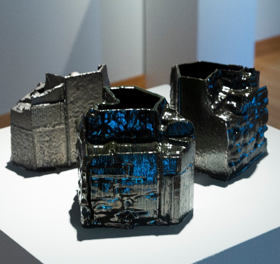 Three white stoneware slip with metallic glaze geometric vessels