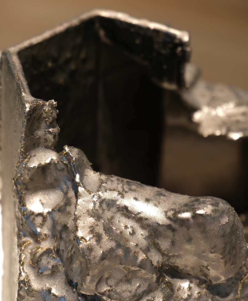 Three white stoneware slip with metallic glaze geometric vessels