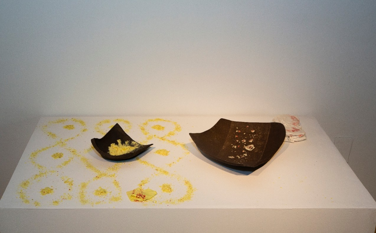 Dark stoneware clay, fired ceramics shards, fabric