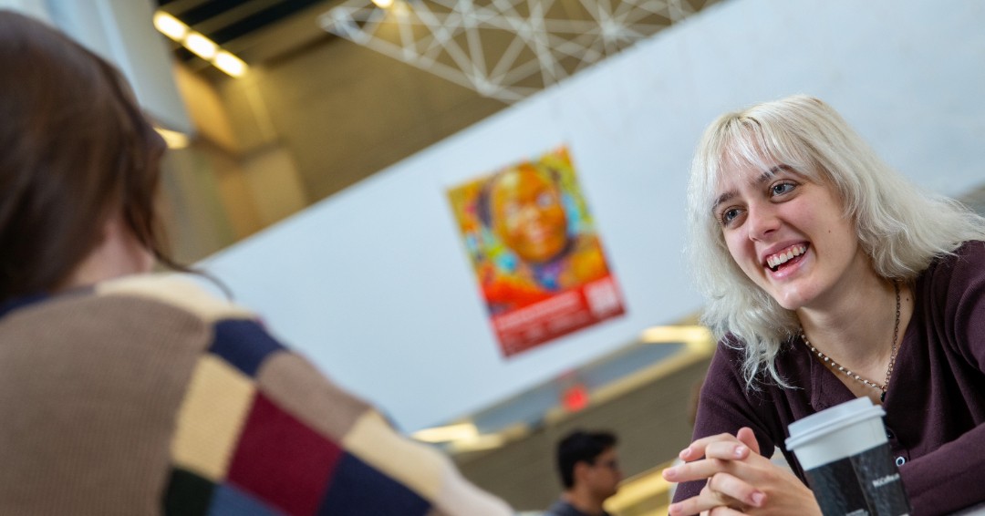 Two DAAP students talking in the cafe.